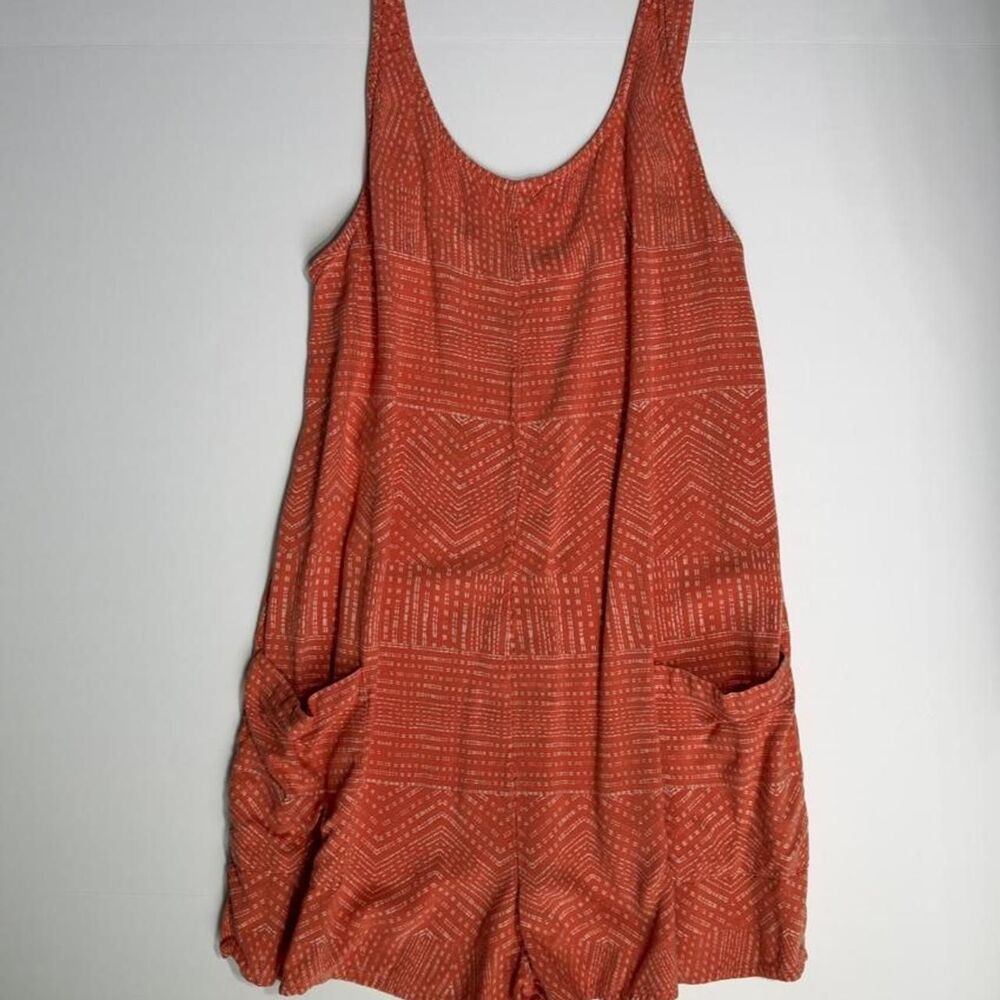 RVCA rust orange romper with white geometric pattern, size Small
